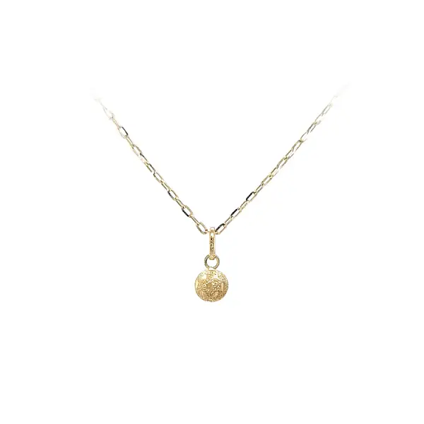 Золотой кулон с изображением пули